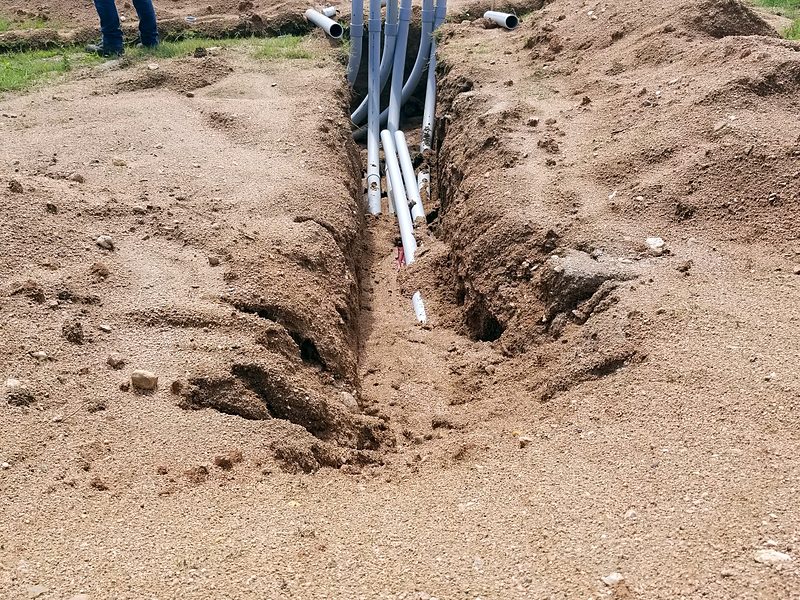 Bundle of conduits laid in an open trench for underground fiber